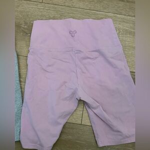 TWO pairs of Aritzia TNA butter biker shorts (heather grey & pink) ; Size XS